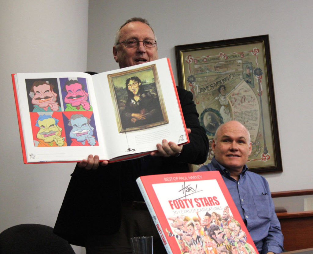 Cartoonist John Spooner was at the MCG Library on July 3rd to help launch Paul Harvey's new book